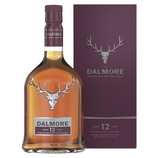 A bottle of The Dalmore 12 Year Old Single Malt Scotch Whisky stands before its maroon box, both with a silver stag logo and white lettering—suggesting flavors of dark chocolate and spiced orange marmalade.