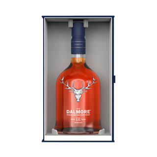 A bottle of The Dalmore 18 Year Old Single Malt Scotch Whisky stands upright in an open box, showcasing the stag logo and white text, with notes of chocolate raisins and spiced gingerbread in each sip.