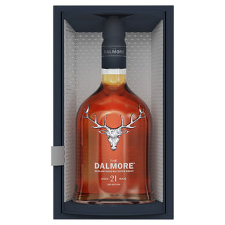 The Dalmore 21 Year Old Single Malt Scotch Whisky stands upright in a refined box with a clear front, featuring the stag logo and silver accents, and evokes dark chocolate notes with a rich, sophisticated character.