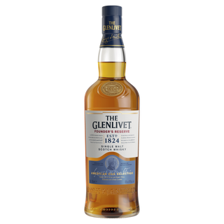 The Glenlivet Founder’s Reserve Single Malt Scotch Whisky offers creamy toffee and sweet malt aromas balanced by subtle citrus notes, presented in a bottle with a blue and white label, gold accents, and a blue ribbon.