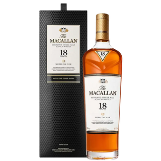 A bottle of The Macallan 18 Year Old Sherry Cask Single Malt Scotch Whisky (2024 Release) stands next to its elegant black and gold box, both displaying refined labels. The whisky has a rich amber hue with notes of oak spice and sherry sweetness.