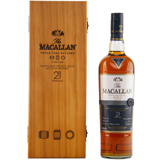 A bottle of The Macallan 21 Year Old Fine Oak Single Malt Whisky stands beside its wooden box, displaying the brand logo and details, while sherry and vanilla notes hint at an indulgent tasting experience.
