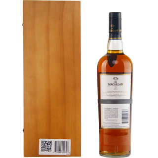 A bottle of The Macallan 21 Year Old Fine Oak Single Malt Whisky stands upright beside a wooden box, both seen from behind. The elegant label has sherry hints, and a QR code appears on the box.