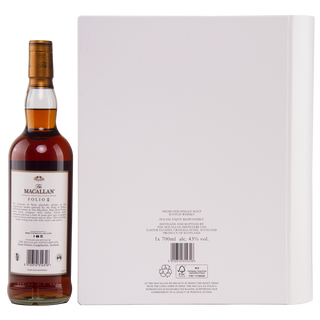 A bottle of The Macallan The Archival Series Folio 8 Single Malt Scotch Whisky stands beside a large white box with minimal branding. The label suggests notes of toffee brittle and sweet oak; product details appear in small print on the box.