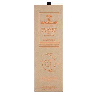 A beige rectangular box for The Macallan Harmony Collection Amber Meadow Single Malt Scotch Whisky, with orange text, a crown logo, and a circular tasting notes diagram showing vanilla, rich oak, honeycomb, and lemon.