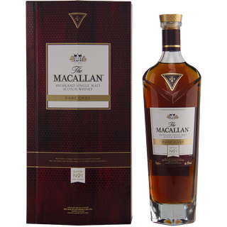 A bottle of The Macallan Rare Cask Release Batch No. 1 Single Malt Scotch Whisky stands beside its tall, rectangular, dark red and gold box, with the label and logo prominently displayed and rich sherry notes promised.