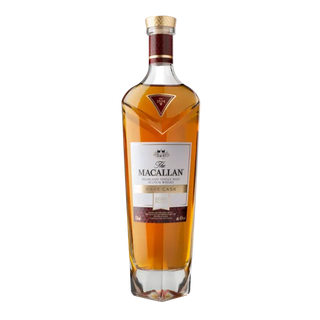 A bottle of The Macallan Rare Cask Single Malt Scotch Whisky (2022 Release) with a gold label, red accents, and wooden cork on a white background, celebrated for sherry sweetness and dark chocolate notes.