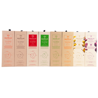 Collection of Macallan whisky boxes in various colors on a white background