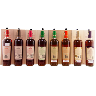 Set of wine bottles with labels on a wooden rack
