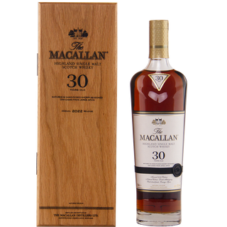 The Macallan 30-year-old whisky bottle and wooden box on a white background