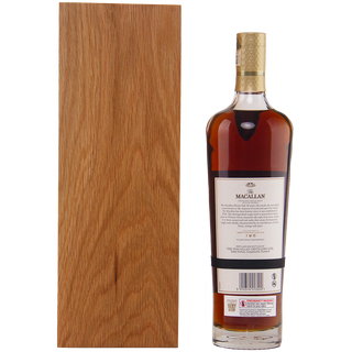 The Macallan whiskey bottle with wooden box on a white background
