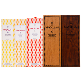 Collection of The Macallan whisky boxes in various ages on a white background