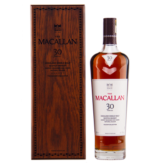 Macallan 30-year-old whisky bottle and wooden box on a white background