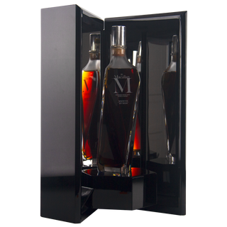 Bottle of Macallan whisky in a black display case