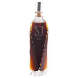 Macallan M whiskey bottle on a white background