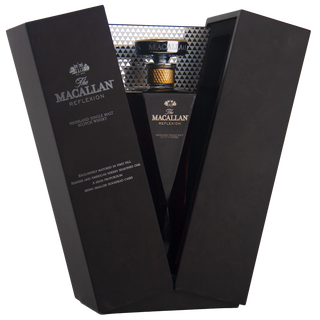 The Macallan whisky in a black box with a glass on a white background