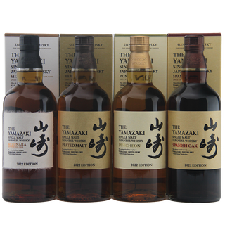 Four bottles of Yamazaki whisky with their packaging on a white background