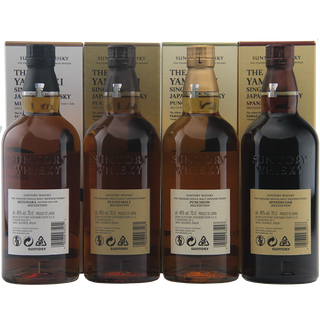 Four bottles of Suntory Whisky with their packaging on a white background