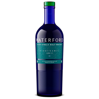 A blue glass bottle of Waterford Biodynamic Luna: Edition 1.1 Single Malt Whisky features white and green text with a green-capped top, highlighting notes of ripe orchard fruits against a plain white background.