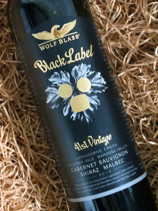 Wolf Blass Black Label wine bottle on a woven background