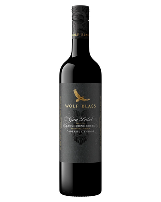 A bottle of Wolf Blass Grey Label Shiraz red wine, featuring a dark grey label with a gold eagle logo and white text, set against a plain white background.