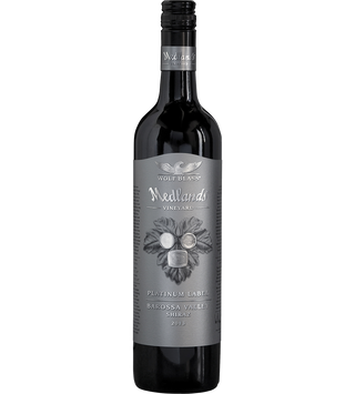 A bottle of Wolf Blacook Meekando Vineyard Platinum Label Balossa Valley Shiraz 2015, featuring a dark glass bottle with a gray label and black cap, set against a plain white background.