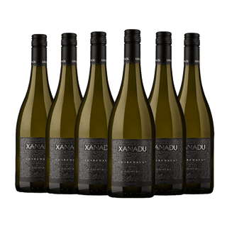 Six bottles of Xanadu Cabernet Sauvignon red wine arranged in a row against a plain white background.