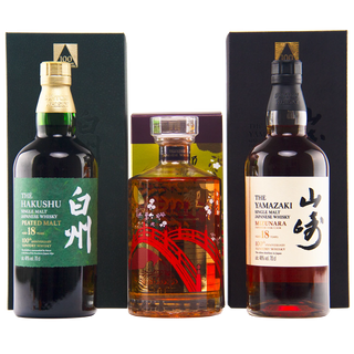 Three bottles of Highland Park single malt whisky with their black packaging boxes, arranged side by side on a white background. The bottles include The Hakushu 18 Year Old, a central bottle with a red bridge graphic, and The Tamazaki 18 Year Old.