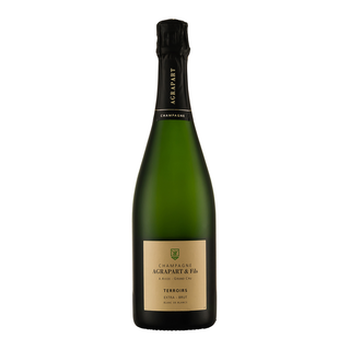 A bottle of Agrapart & Fils Grand Cru Terroirs Blanc de Blancs Extra-Brut NV, in dark green glass with a beige label, stands upright on a white background, suggesting fine mousse and chalky minerality.