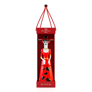 The Doña Celia Añejo Tequila 100ml features a decorative bottle shaped like a woman in a red dress and hat with heart cutouts, packaged upright in a matching red box with handle. Its elegant, festive tequila notes are reminiscent of vanilla and oak.