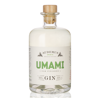 Audemus Umami Gin 500ml is a clear glass bottle of Japanese Mediterranean gin with herbal spice and savory botanicals, featuring a wooden cork, white label with green text, 42% ABV, and "oak finished" beneath Umami.