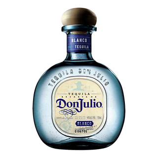 A Don Julio Blanco Tequila 700ml & Shaker Gift Set featuring a clear, round bottle with a beige-blue label, natural wood stopper, and crafted from premium agave. The set includes branded label details and a cocktail shaker.