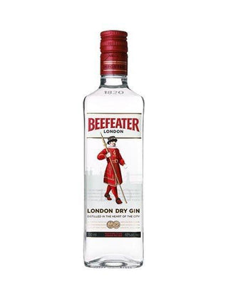 A clear glass bottle of Beefeater Gin with a red cap, featuring a label showing a Beefeater guard in red uniform, and text highlighting its London distillation and classic juniper and citrus notes.