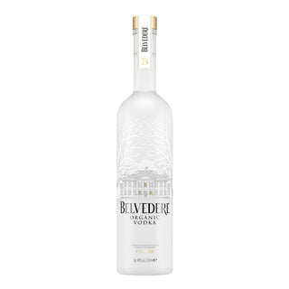 A tall, frosted glass bottle of Belvedere Pure Vodka 1L with a gold and white cap, featuring a building and tree branches on the label. Made from rye grain for a refined texture and creamy palate. The label reads Belvedere Pure Vodka 1L.