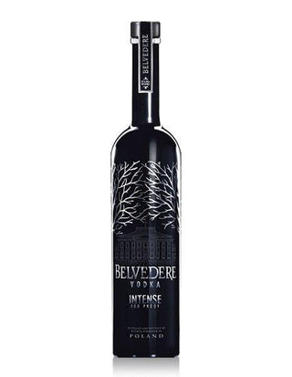 A tall, sleek black bottle of Belvedere Unfiltered Vodka with white tree designs and silver text on the label stands upright against a plain white background, offering a creamy, full-bodied character in every sip.