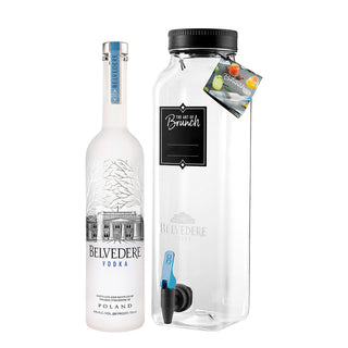 A frosted glass Belvedere Vodka + Brunch Jar 700ml stands beside a creamy dispenser with a black label, blue spout, and The Art of Brunch and Belvedere Vodka logos.