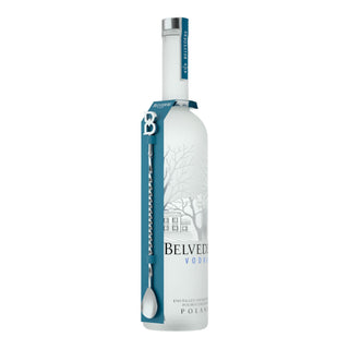 A tall, frosted 700ml Belvedere Vodka & Bar Spoon bottle from Poland features a blue tag and metal bar spoon on the neck. The label displays a building and trees, emphasizing the vodka’s smooth palate and sophisticated character.