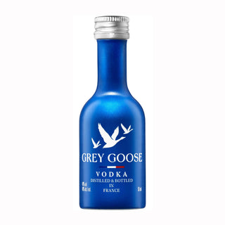 Grey Goose Vodka 50ml: A small blue bottle with a silver cap, white flying geese and branding on the label, renowned for its smooth, rounded taste and soft floral notes.