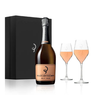 The Billecart-Salmon Le Rose NV + 2 Glasses Gift Set features a bottle of delicate, pale pink champagne with ultra-fine bubbles and elegant red fruit notes, displayed in front of a black gift box and accompanied by two filled glasses.