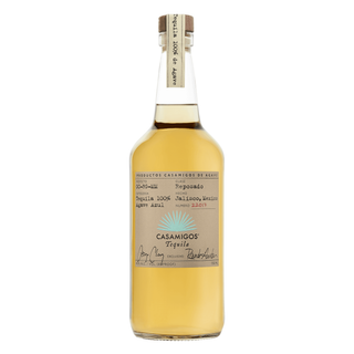 Casamigos Reposado Tequila 700ml comes in a clear bottle with a beige label and handwritten-style text, filled with golden tequila boasting roasted agave and caramel notes.