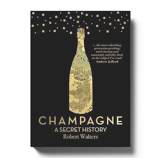 The Revolution Grower Champagne Gift Box features a golden champagne bottle design with a map inside, fine bubbles above, and a glowing review quote, all set against a sleek black background.