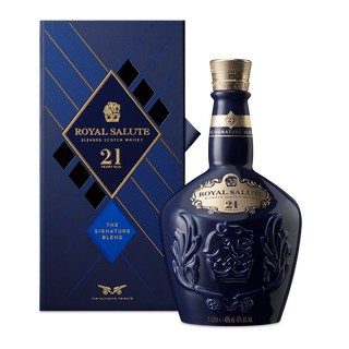 A blue bottle of Royal Salute 21 Year Old Blended Scotch Whisky stands beside its matching box, adorned with elegant gold accents and embossed details, offering notes of vanilla and baked apples.