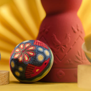 A group of objects on a yellow background channels the subtle, herbal essence of Clase Azul Mezcal San Luis Potosi 750ml, evoking sunlit agave in every arrangement.