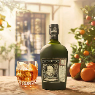 700ml bottle of Diplomatico Reserva Exclusiva dark rum with golden amber colour and classic portrait label.