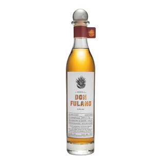Don Fulano Añejo Tequila 700ml comes in a tall, clear bottle with golden liquid, a round glass stopper, and a brown label with agave graphics. Enjoy sweet agave flavors and hints of vanilla.