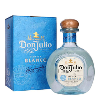 A 700ml bottle of Don Julio Blanco Tequila with a blue cap stands beside its matching blue box, both showing the brand’s name and signature in white and gold—renowned for authentic agave flavor and an exceptionally smooth finish.