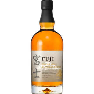 Fuji Single Malt Japanese Whisky features amber liquid in a bottle with a black cap and cream label adorned with gold text, Japanese kanji, the distillery name, and a mountain graphic. Tasting notes include white peaches and fruit tart.