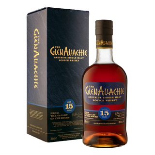 A bottle of GlenAllachie 15 Year Old Single Malt Scotch Whisky stands beside its matching dark blue and gold box. The label highlights its Speyside origin, age, and notes of sweet spice with floral honey.