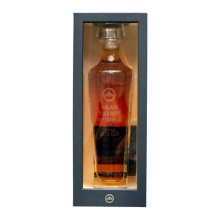 Gran Patron Piedra Extra Anejo Tequila 750ml comes in a dark rectangular display box with a clear window, revealing the amber spirit and branded label, and offers rich notes of sweet agave and caramel.