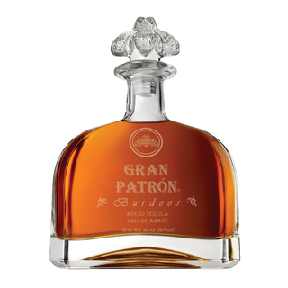 A 750ml bottle of Gran Patron Burdeos Añejo Tequila, featuring amber liquid, an ornate glass stopper, and elegant silver text on the front, showcased against a white background with notes of sweet agave and toasted oak.